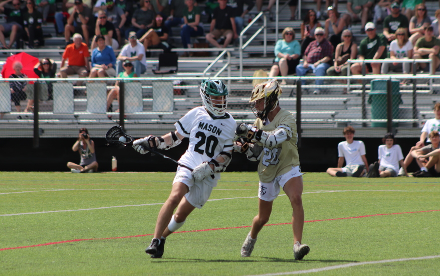 two boys defending on field